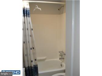 549 Millbank Road Upper Darby, PA 19082 - Photo 12 of 12 a bathroom with a bathtub and a shower