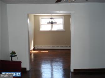 549 Millbank Road Upper Darby, PA 19082 - Photo 3 of 12 a view of a hallway with front door
