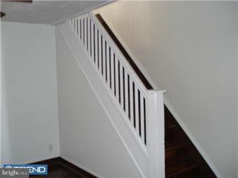 549 Millbank Road Upper Darby, PA 19082 - Photo 4 of 12 a view of staircase with railing and white walls