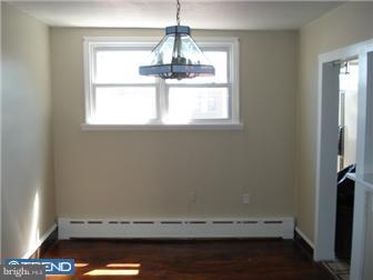 549 Millbank Road Upper Darby, PA 19082 - Photo 6 of 12 a view of room with hardwood floor and window