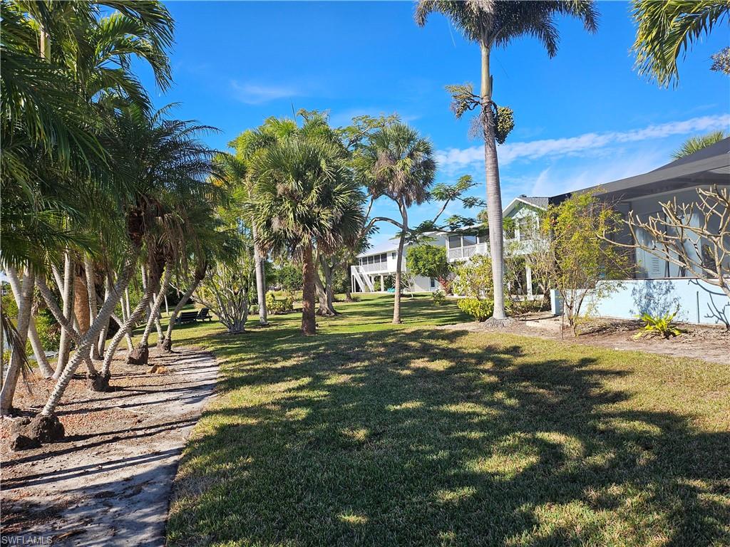 7791 Grande Pine Road Bokeelia, FL 33922 - Photo 17 of 45 a view of a park with palm trees