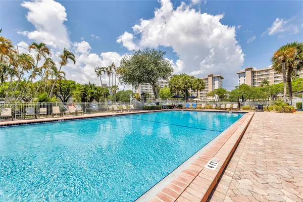 a view of a swimming pool and an outdoor space