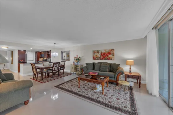 a living room with furniture and a rug