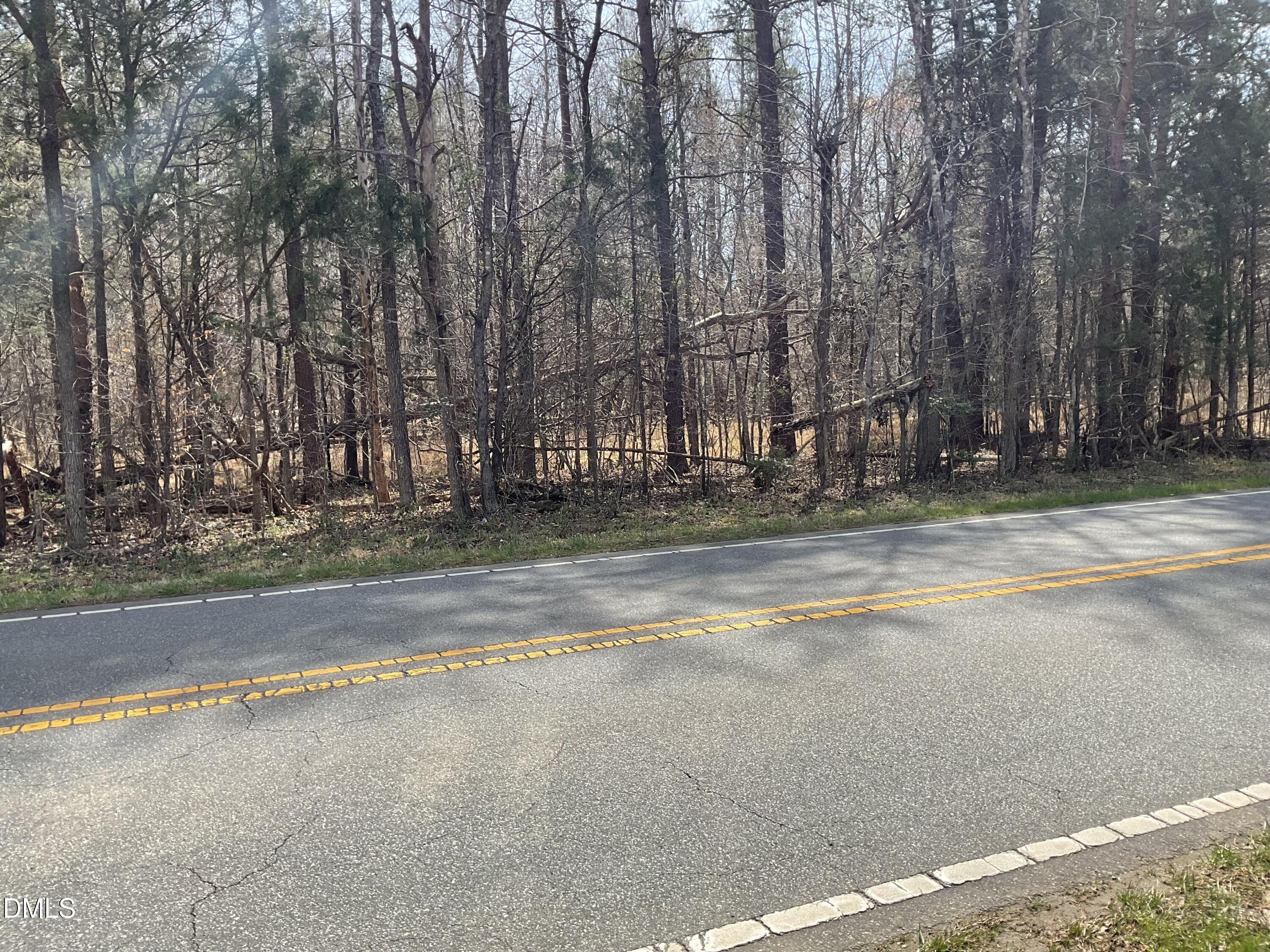 a view of pool and trees in the background