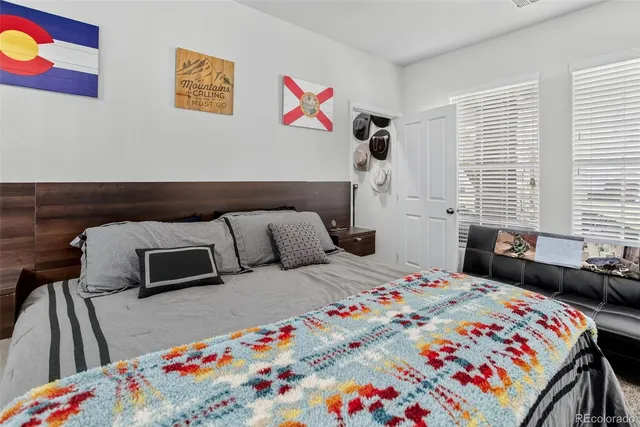 a bedroom with a bed and a dresser