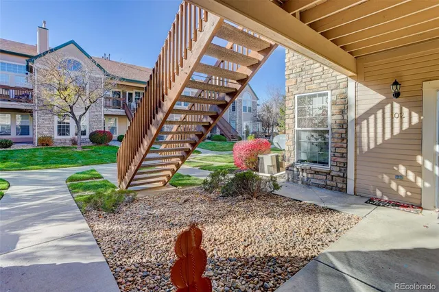 a view of a house with a yard porch and sitting area