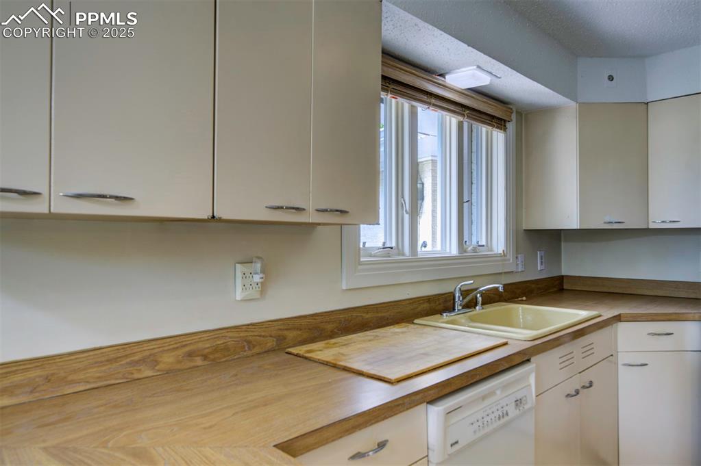130 Cresta Road Colorado Springs, CO 80906 - Photo 19 of 49 a kitchen with a sink and cabinets