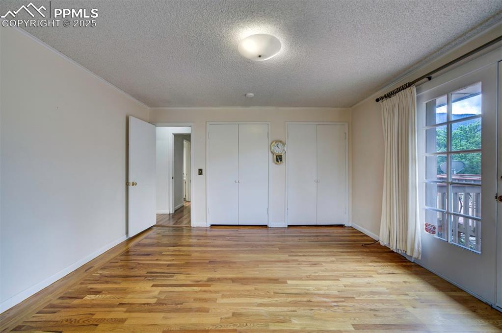 130 Cresta Road Colorado Springs, CO 80906 - Photo 28 of 49 a view of room with window and wooden floor