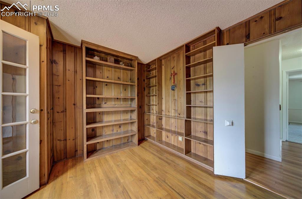 130 Cresta Road Colorado Springs, CO 80906 - Photo 31 of 49 a room with walk in closet and wooden floor
