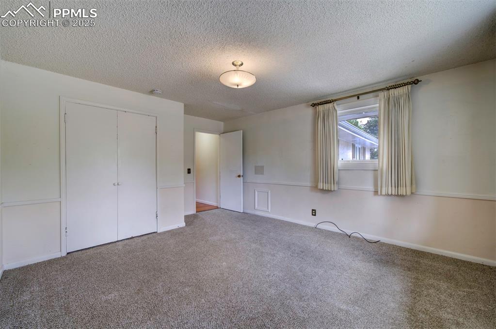 130 Cresta Road Colorado Springs, CO 80906 - Photo 33 of 49 a view of an empty room with a window