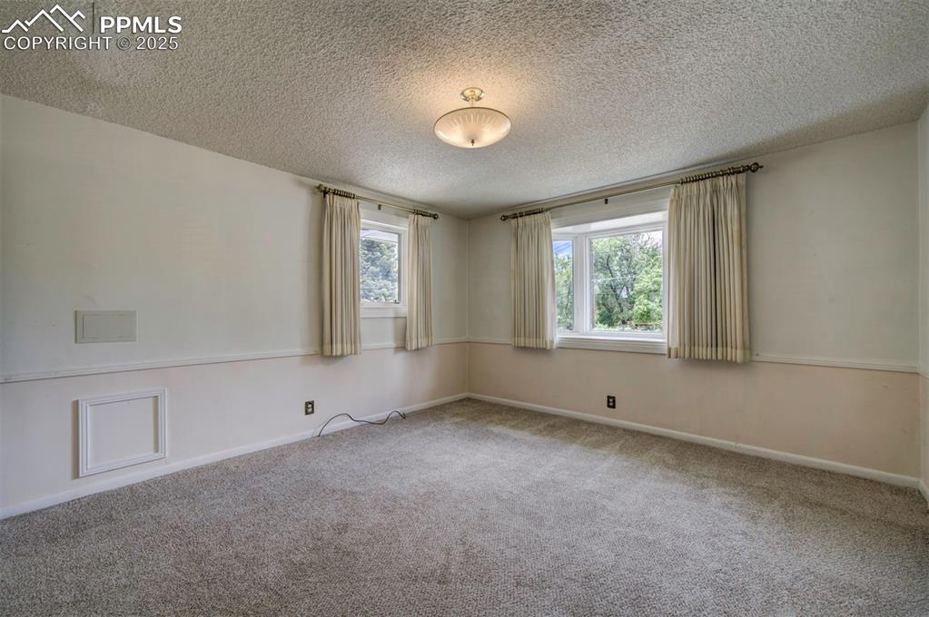 130 Cresta Road Colorado Springs, CO 80906 - Photo 34 of 49 an empty room with windows
