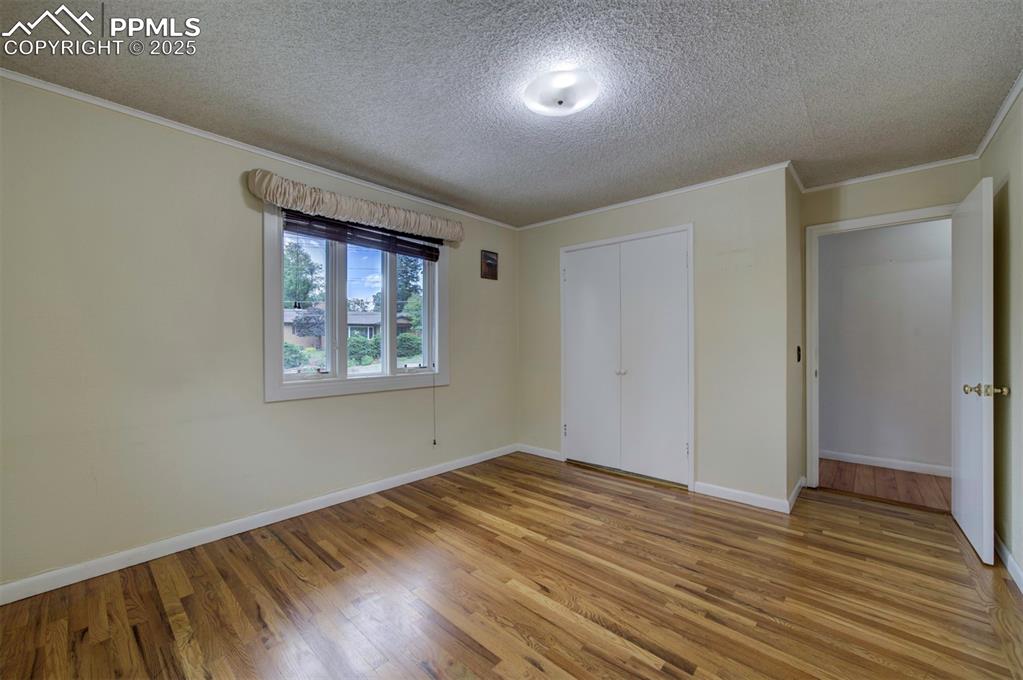 130 Cresta Road Colorado Springs, CO 80906 - Photo 36 of 49 a view of empty room with wooden floor and fan