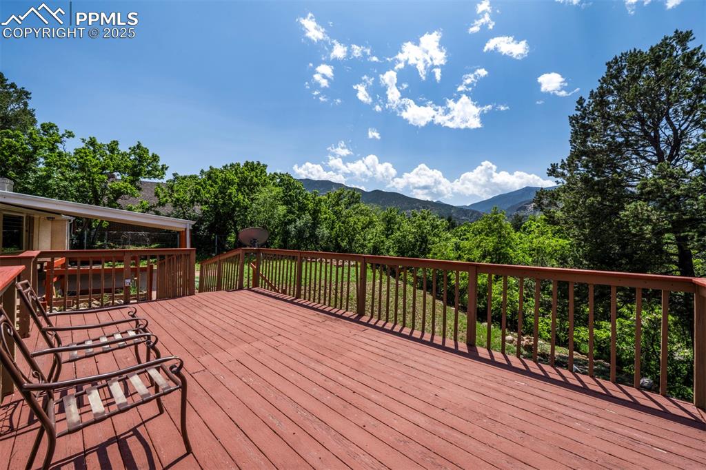 130 Cresta Road Colorado Springs, CO 80906 - Photo 43 of 49 a view of balcony with wooden floor and outdoor seating