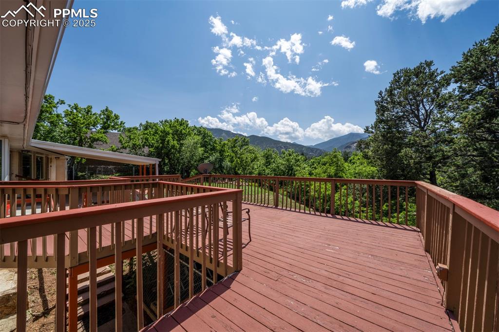 130 Cresta Road Colorado Springs, CO 80906 - Photo 44 of 49 a balcony with wooden floor and city view