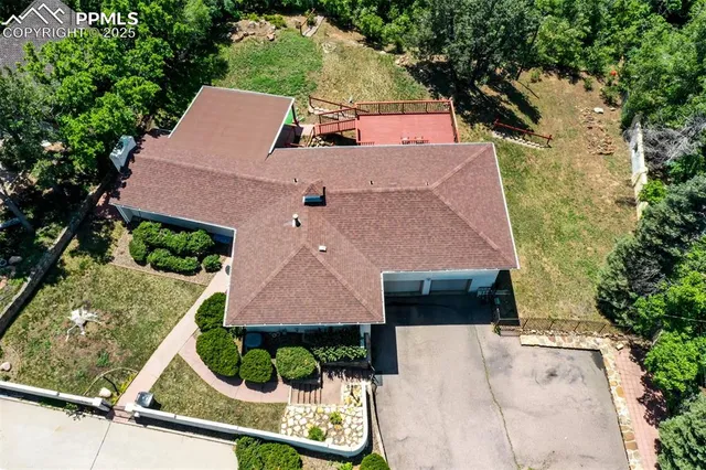 an aerial view of house with a yard