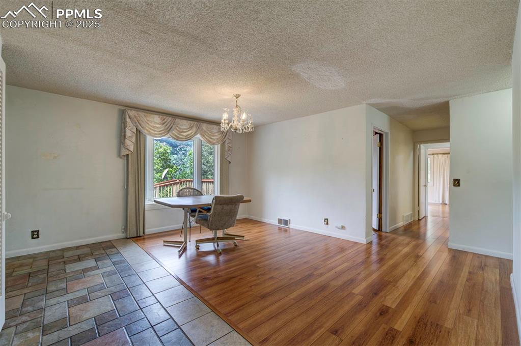 130 Cresta Road Colorado Springs, CO 80906 - Photo 7 of 49 a view of a room with wooden floor and a window