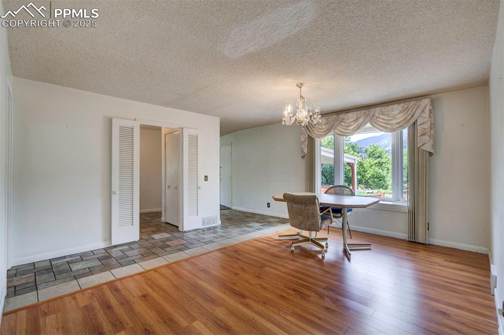 130 Cresta Road Colorado Springs, CO 80906 - Photo 9 of 49 a view of a livingroom with wooden floor and a window