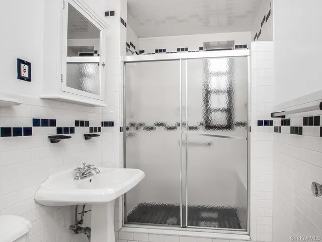 a bathroom with a sink and mirror