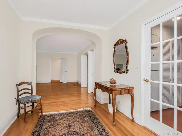 a view of living room with furniture and wooden floor