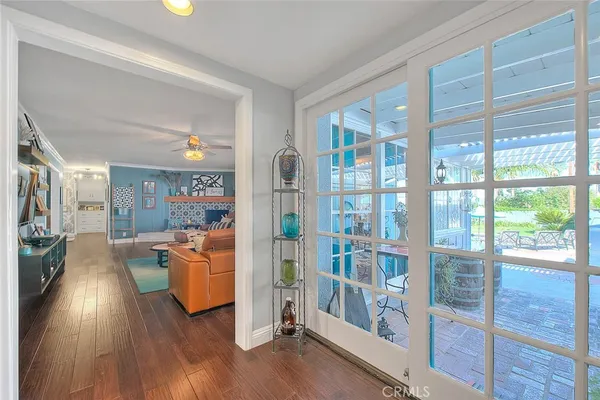 a kitchen with granite countertop a refrigerator and a stove top oven