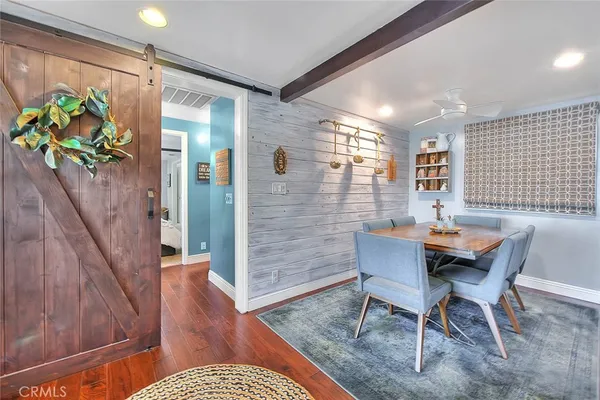 a bedroom with furniture and a rug