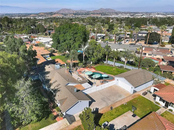 a view of pool with a yard