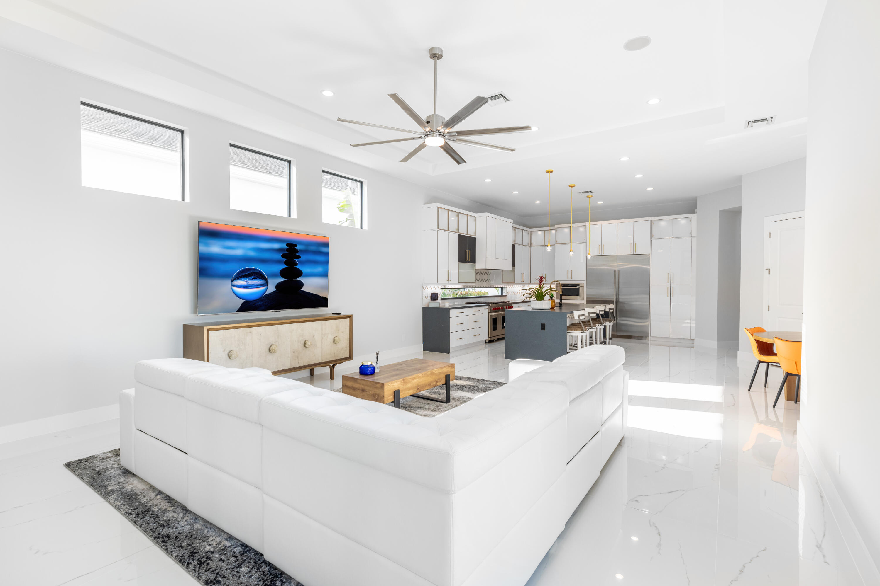 2740 Northwest 69th Street Boca Raton, FL 33496 - Photo 25 of 79 a living room with furniture and kitchen view