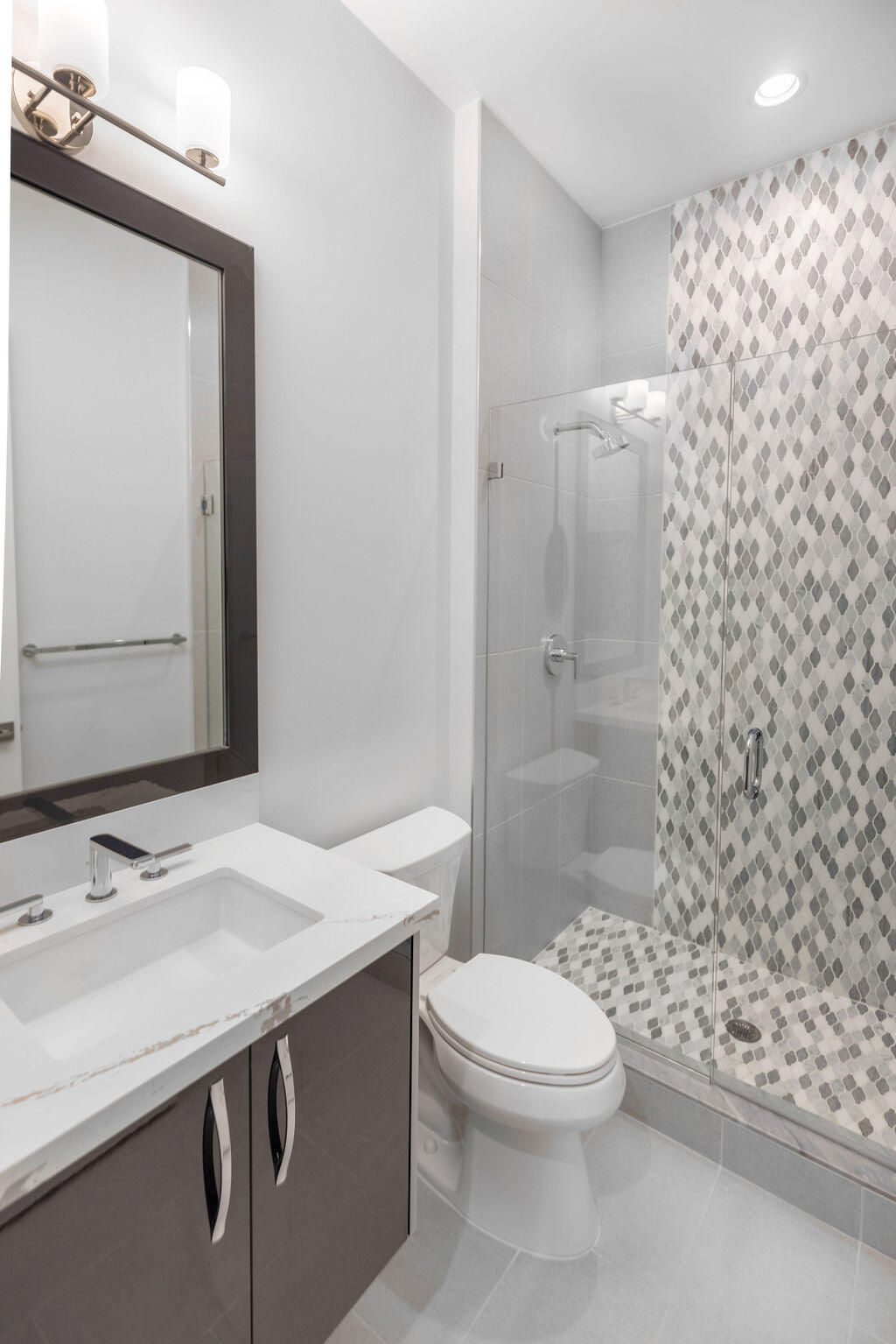 2740 Northwest 69th Street Boca Raton, FL 33496 - Photo 49 of 79 a bathroom with a sink a toilet and shower
