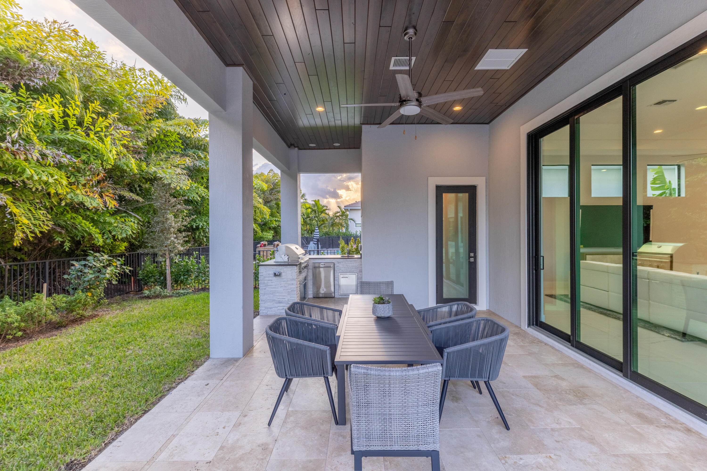 2740 Northwest 69th Street Boca Raton, FL 33496 - Photo 63 of 79 a view of an outdoor dining space with a table and chairs