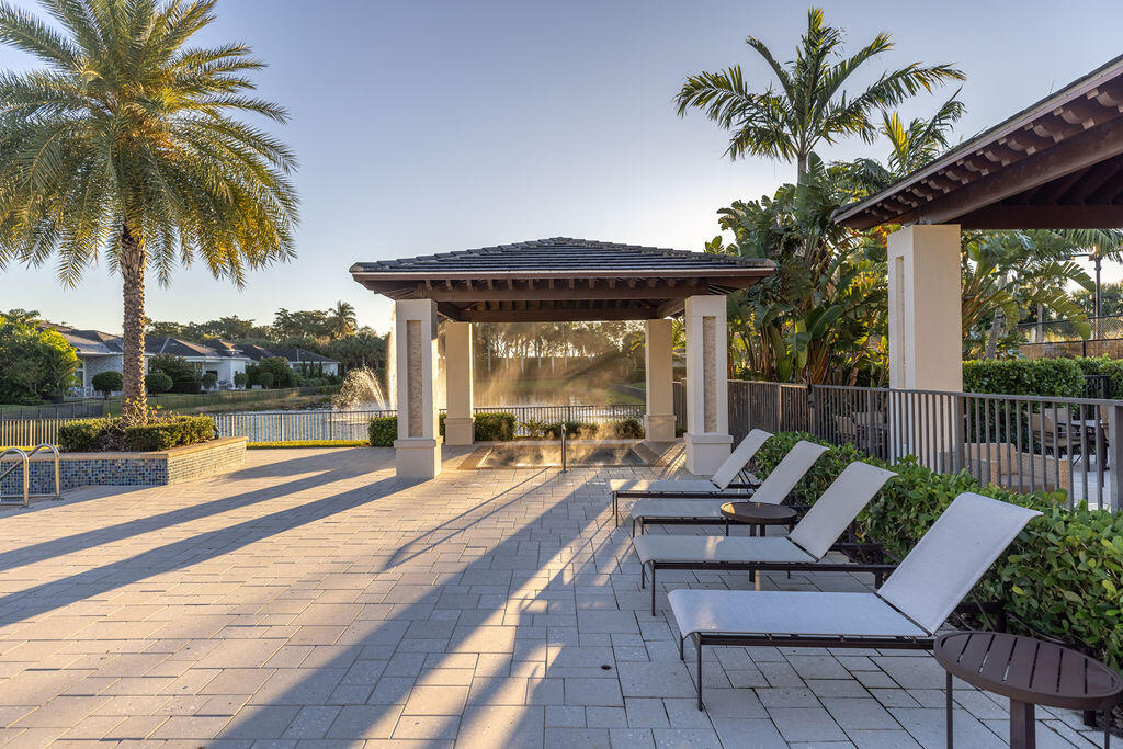 2740 Northwest 69th Street Boca Raton, FL 33496 - Photo 69 of 79 a view of a patio with swimming pool table and chairs