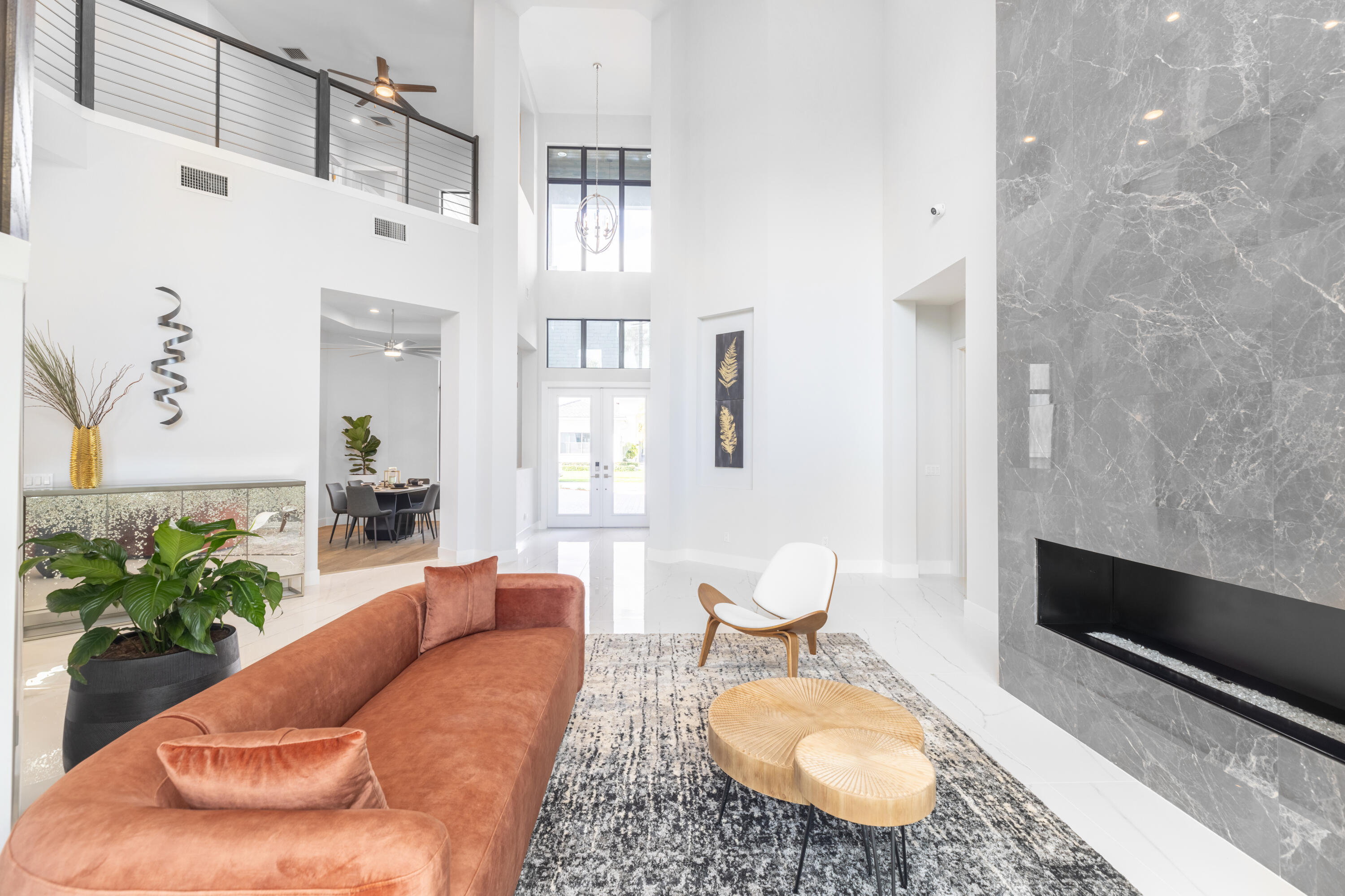 2740 Northwest 69th Street Boca Raton, FL 33496 - Photo 7 of 79 a living room with furniture a rug and a toilet