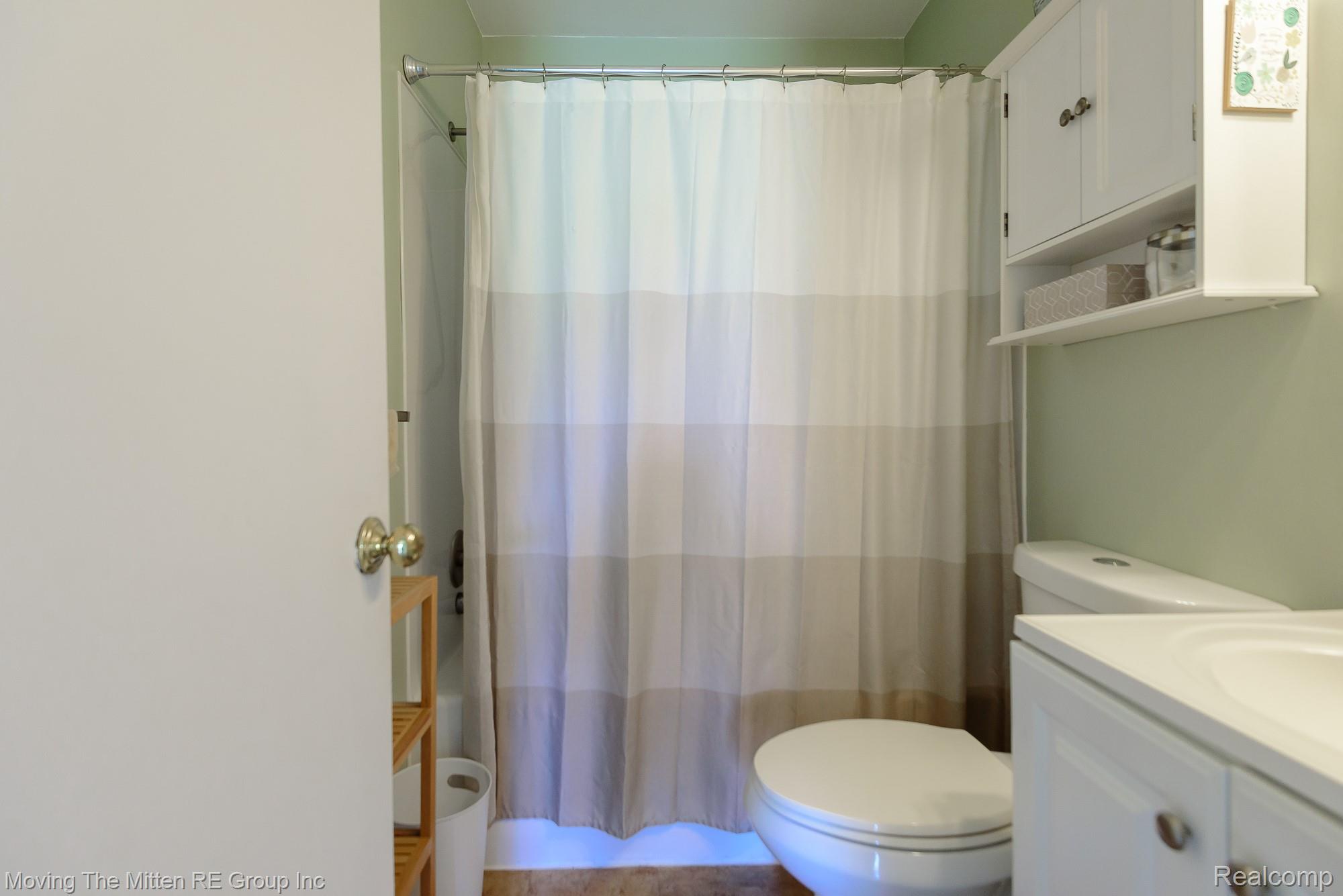 9260 Pitman Road Ypsilanti, MI 48197 - Photo 22 of 45 Bathroom featuring vanity and a shower with shower curtain