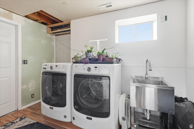 1095 Park Avenue Logan, UT 84321 - Photo 18 of 27 Laundry room featuring wood finished floors and washer and dryer