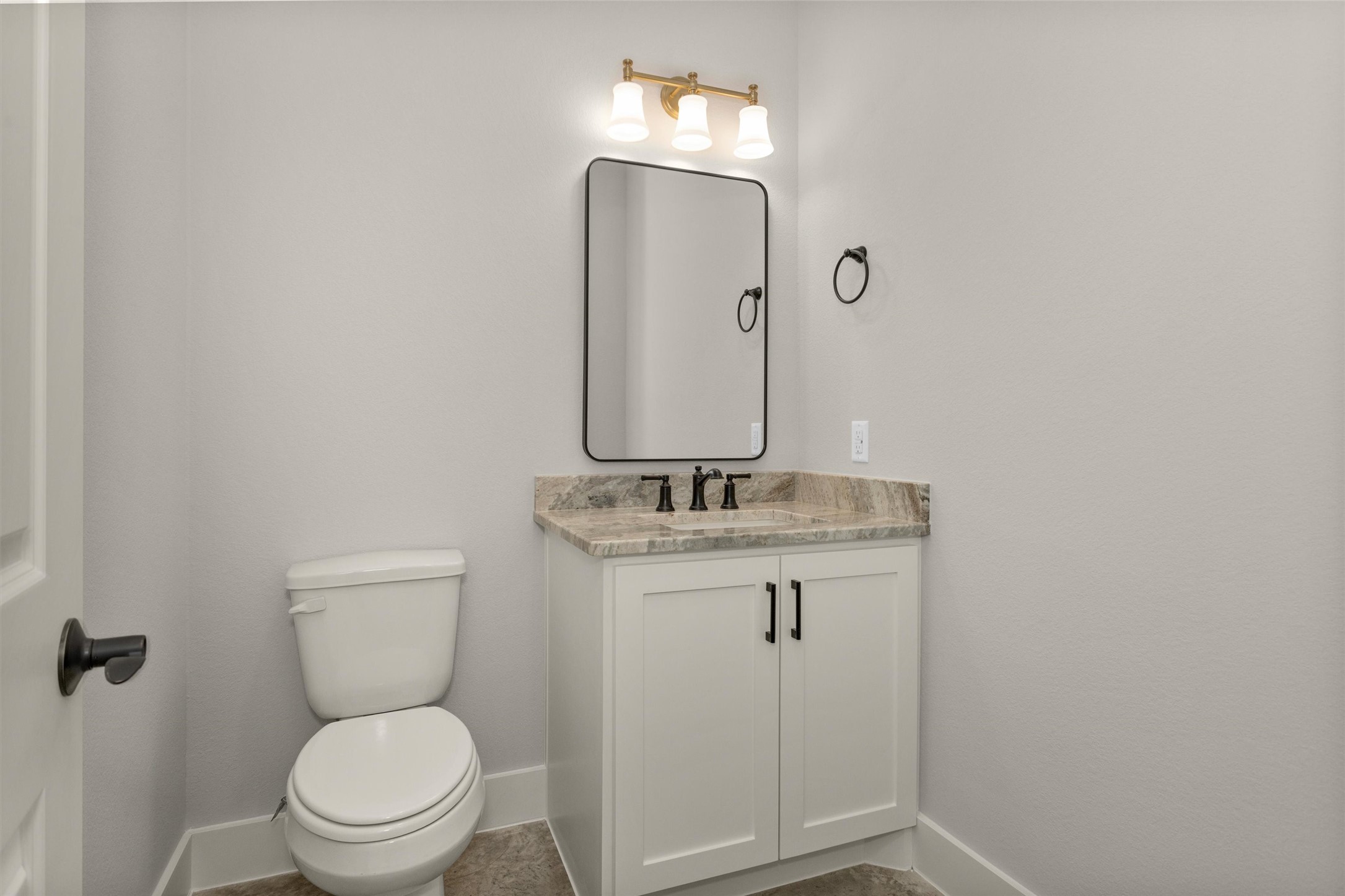 12744 Oak Barrel Road Willis, TX 77378 - Photo 36 of 50 Conveniently located just down the hall from the living room and kitchen, the half bath is perfectly positioned for guests. This thoughtfully placed powder room offers both privacy and accessibility, making it ideal for entertaining.