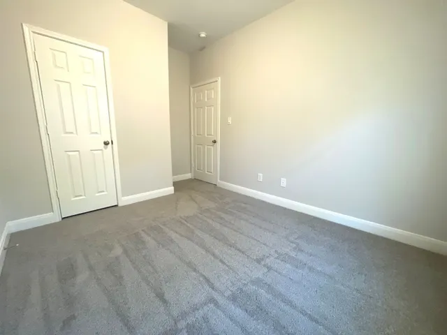 an empty room with wooden floor