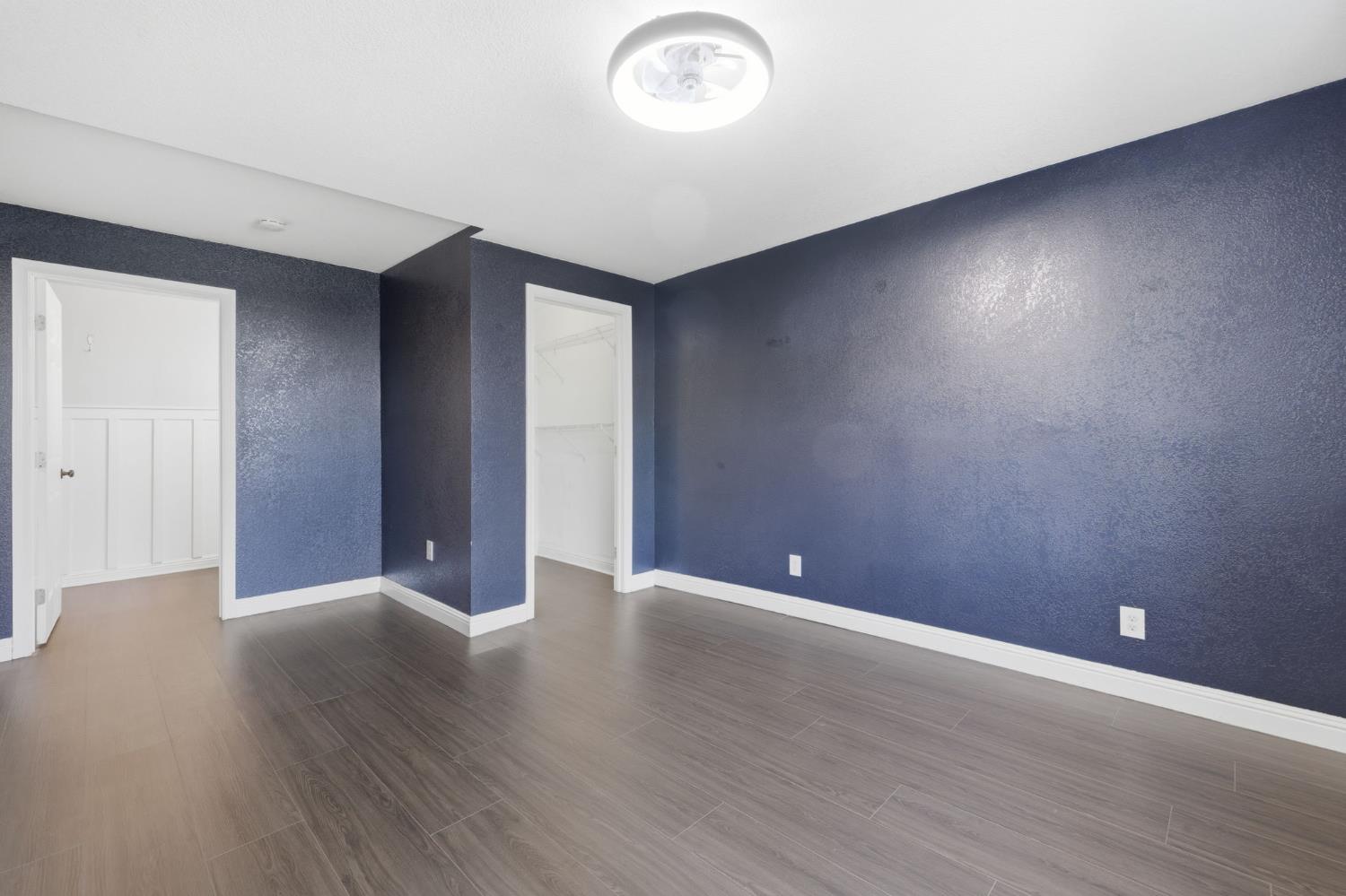 7580 Latrobe Road Shingle Springs, CA 95682 - Photo 11 of 56 a view of an empty room with wooden floor