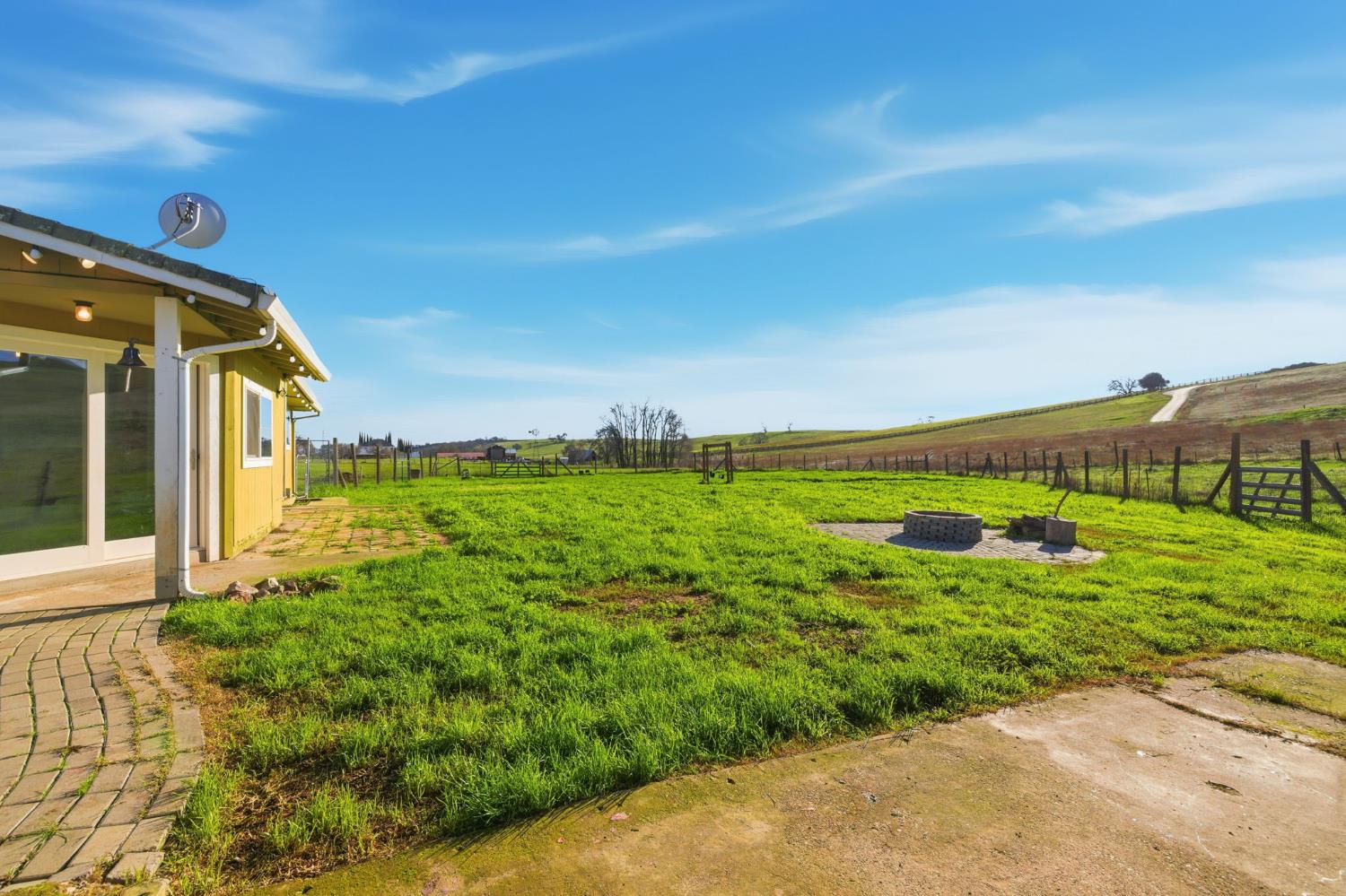 7580 Latrobe Road Shingle Springs, CA 95682 - Photo 15 of 56 a view of a big yard with potted plants
