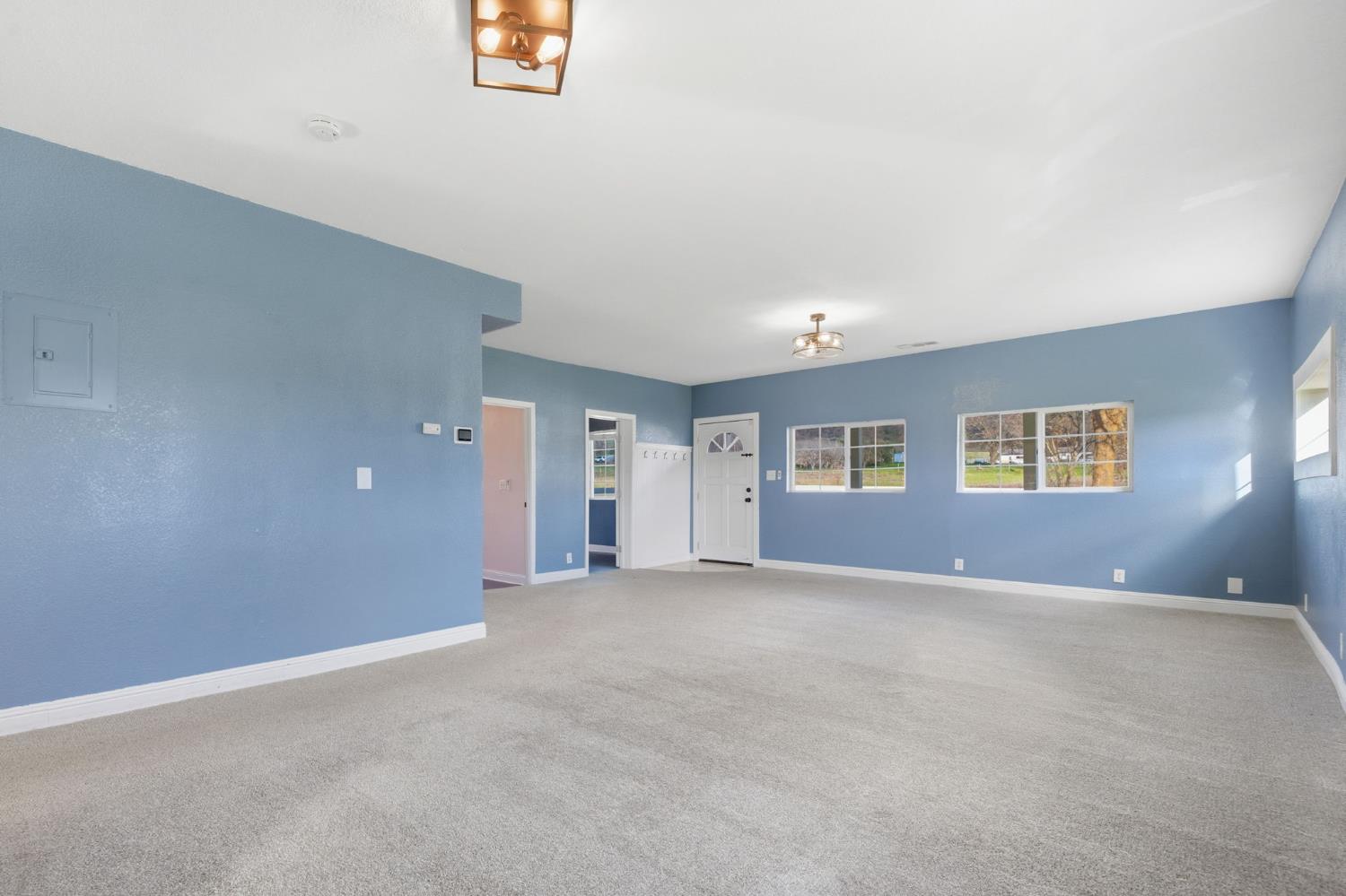 7580 Latrobe Road Shingle Springs, CA 95682 - Photo 18 of 56 an empty room with windows and closet