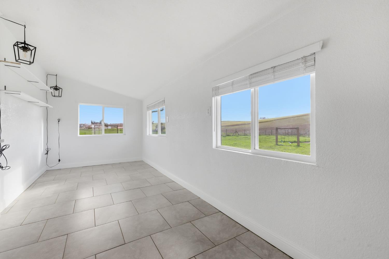 7580 Latrobe Road Shingle Springs, CA 95682 - Photo 32 of 56 a view of an empty room with a window