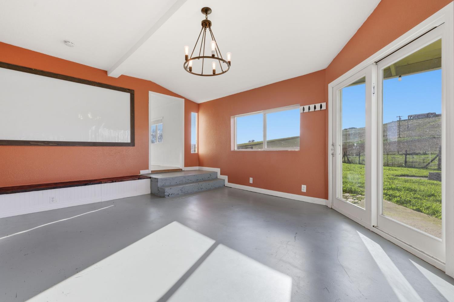 7580 Latrobe Road Shingle Springs, CA 95682 - Photo 34 of 56 a view of an empty room with windows
