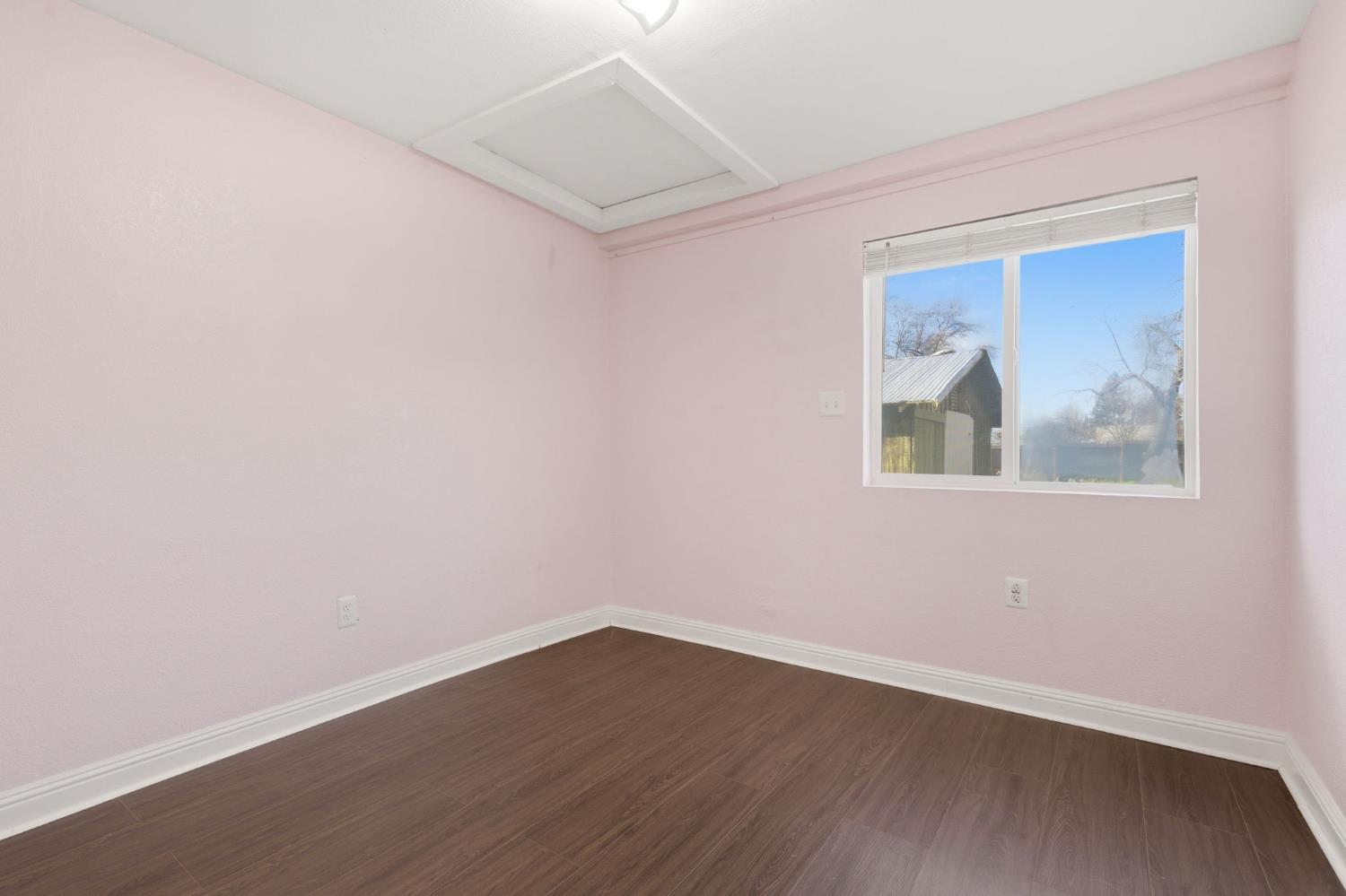 7580 Latrobe Road Shingle Springs, CA 95682 - Photo 36 of 56 a view of empty room with wooden floor and fan