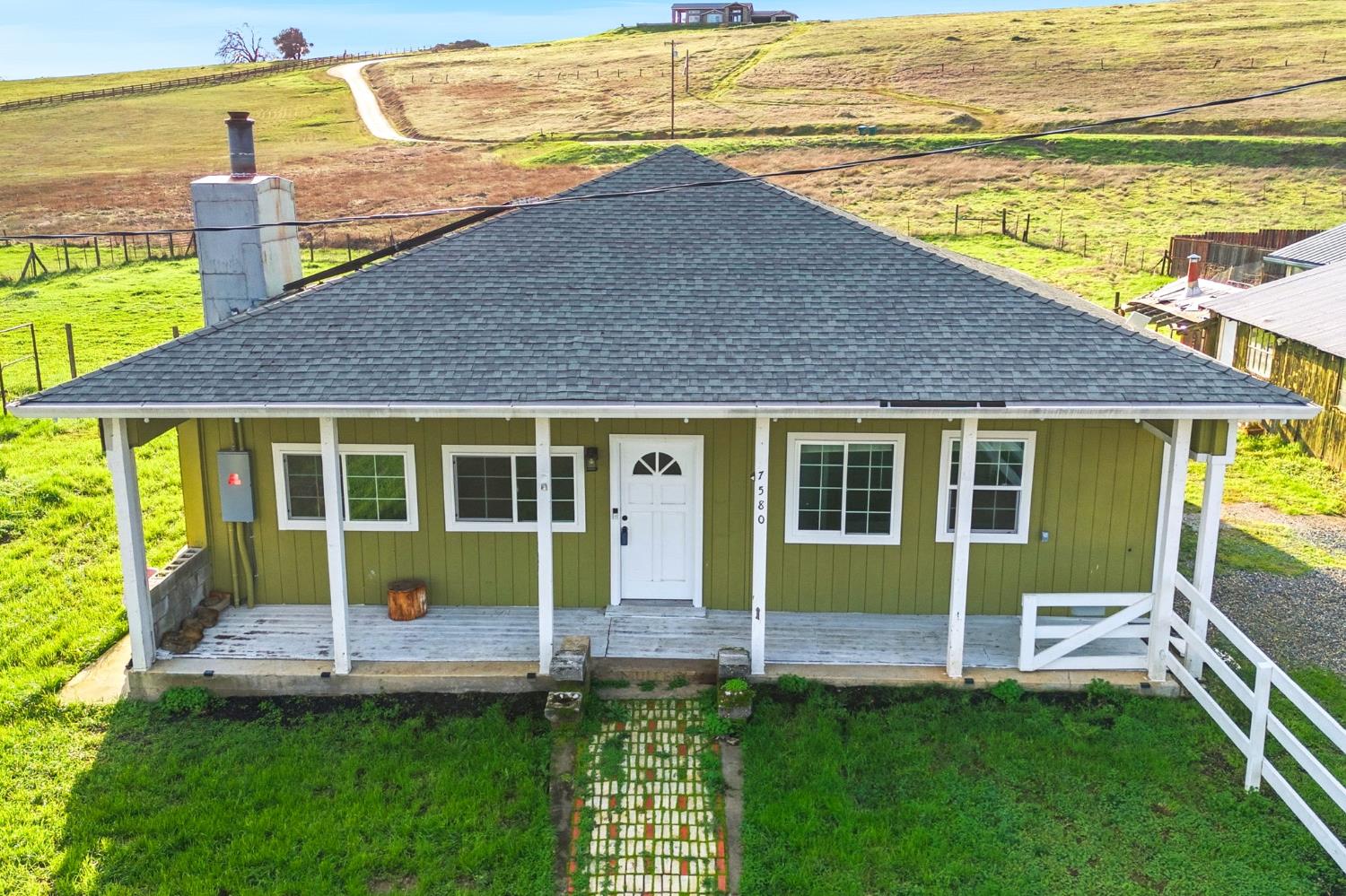 7580 Latrobe Road Shingle Springs, CA 95682 - Photo 42 of 56 a view of house with a yard and swimming pool