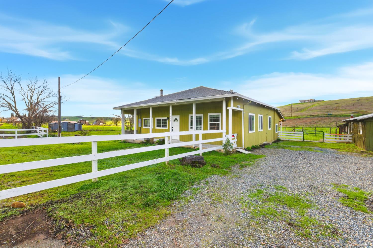 7580 Latrobe Road Shingle Springs, CA 95682 - Photo 50 of 56 a view of an house with backyard space and balcony