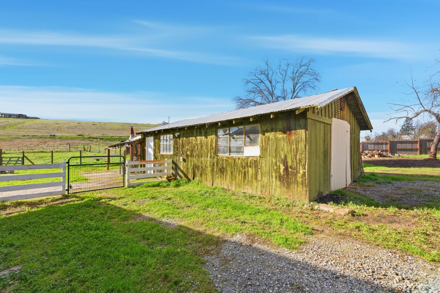 7580 Latrobe Road Shingle Springs, CA 95682 - Photo 52 of 56 a view of an house with backyard and garden