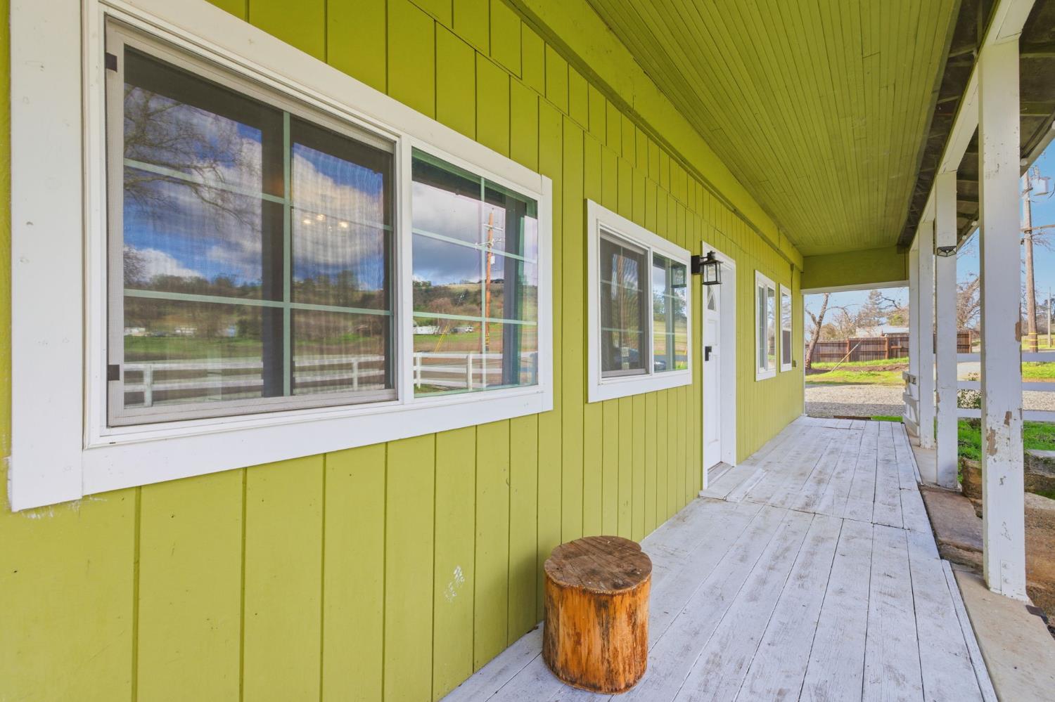 7580 Latrobe Road Shingle Springs, CA 95682 - Photo 53 of 56 a view of a porch with wooden floor and outdoor space