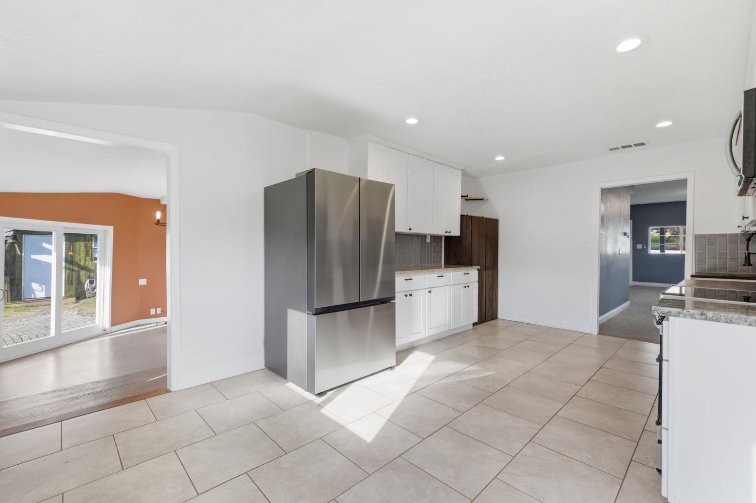 7580 Latrobe Road Shingle Springs, CA 95682 - Photo 9 of 56 a kitchen with stainless steel appliances a refrigerator and a stove