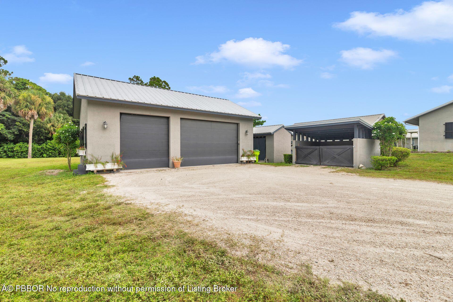 2770 E Road Loxahatchee, FL 33470 - Photo 4 of 51 a house with a outdoor space
