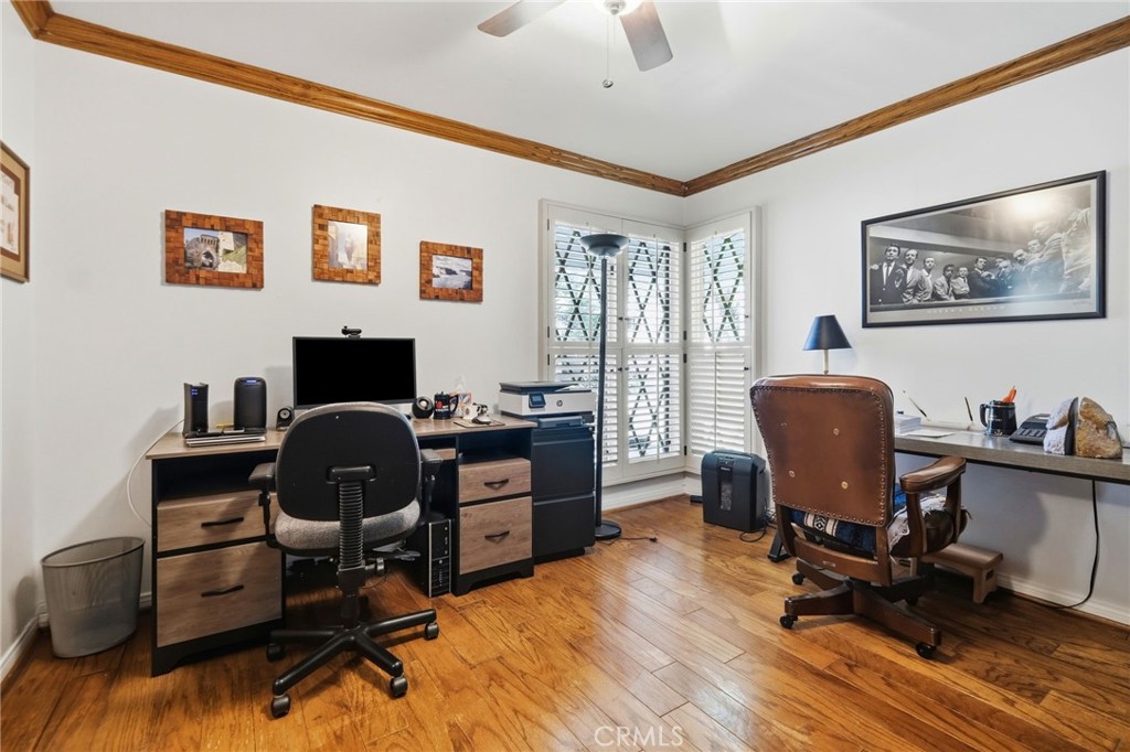 18233 Charlton Lane Porter Ranch, CA 91326 - Photo 7 of 40 a view of a workspace with furniture and a window