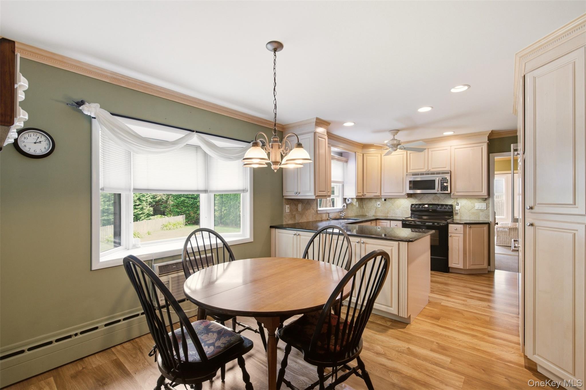2 Ottawa Avenue Centerport, NY 11721 - Photo 5 of 15 a view of a dining room with furniture window and wooden floor