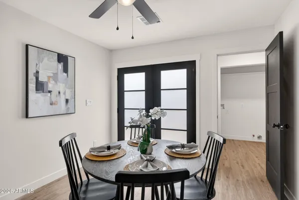 a bedroom with a bed and a night stand